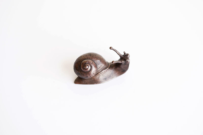 A picture of 'Miniature Bronze Baby Snail '