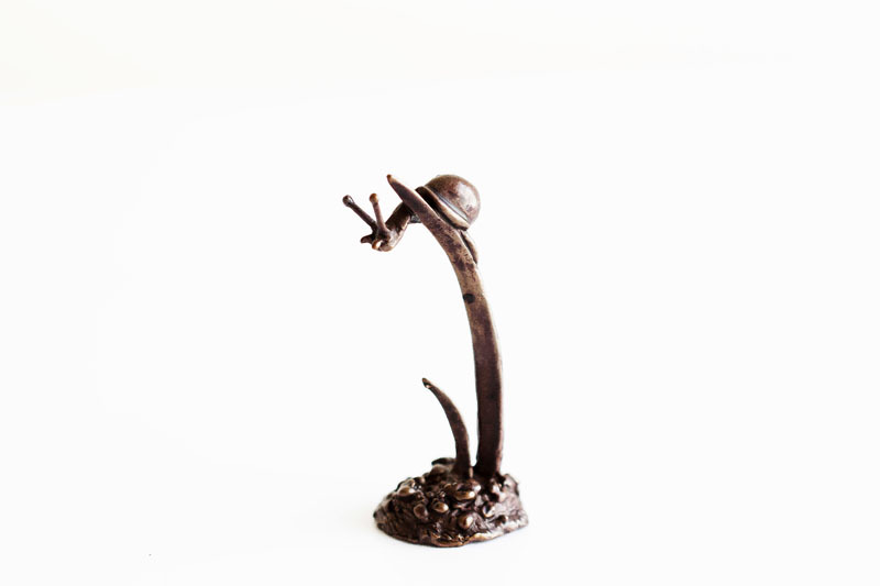 A picture of 'Miniature Bronze Snail on Grass'