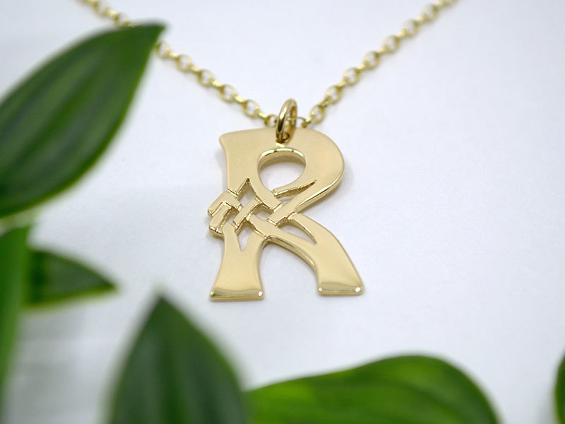 A picture of '9ct Gold Pendant - Initial R'
