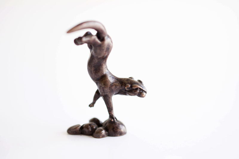 A picture of 'Miniature Bronze Swimming Otter''
