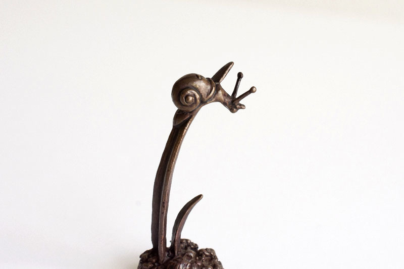A picture of 'Miniature Bronze Snail on Grass''