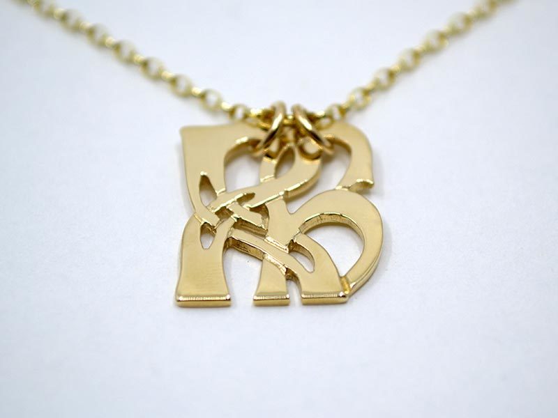 A picture of '18ct Gold Pendant - Initial RH''